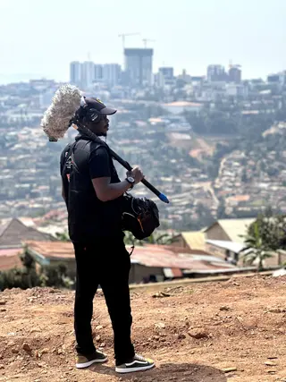 GoodAV field sound recordist capturing pristine acoustic dialogue on location in Rwanda for NGO advocacy documentary