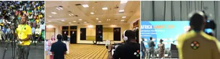 Professional media team filming and broadcasting a summit event in an arena and conference hall.