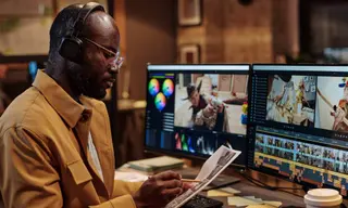 Professional video editor using AI-powered post-production audio and color grading software in Kigali - GoodAV