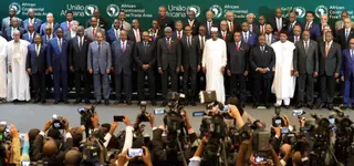 International heads of state and delegates at African summit plenary with broadcast staging and LED walls in Kigali - GoodAV